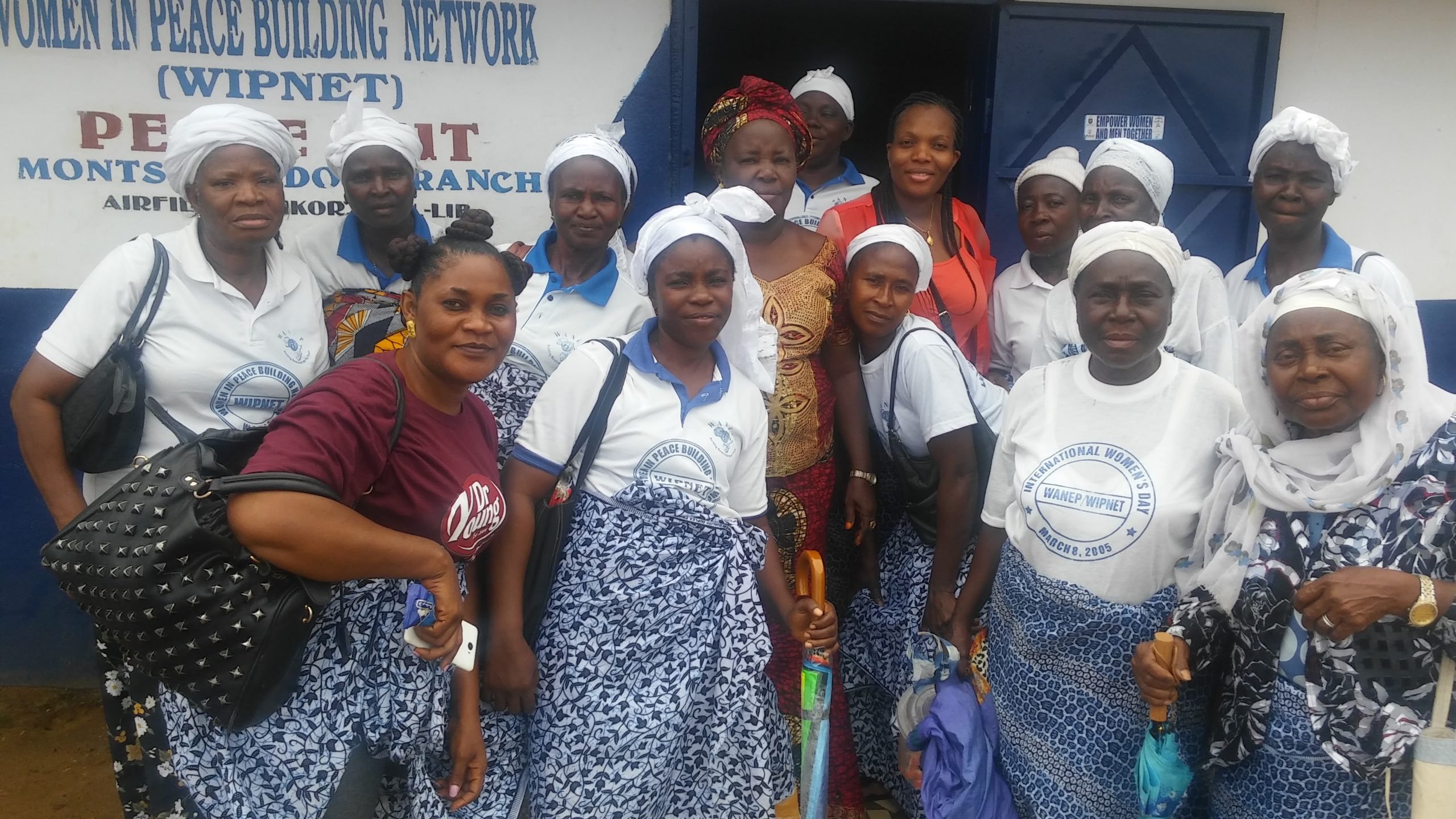 Women and youth smiling together at an economic empowerment event